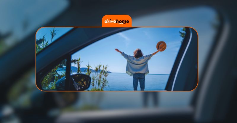 a happy woman with her car near the beach