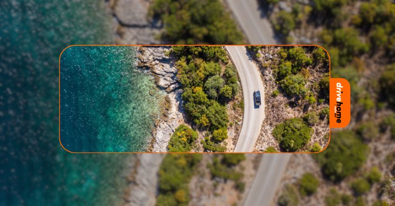 a car driving by the sea